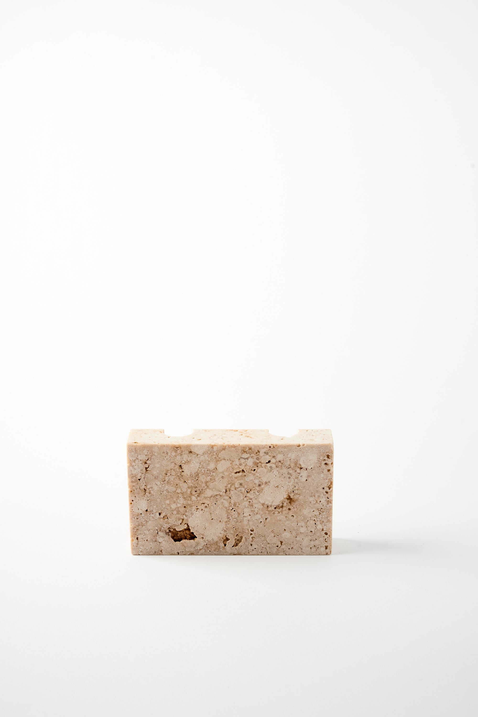 SANNA VÖLKER SMOOTH TRAVERTINE SNUG CANDLE HOLDER